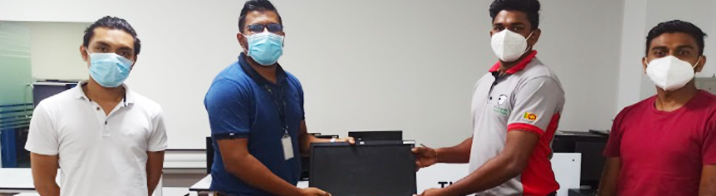 Members of TSG and the Leo Club donating computers to a rural school to enhance educational opportunities